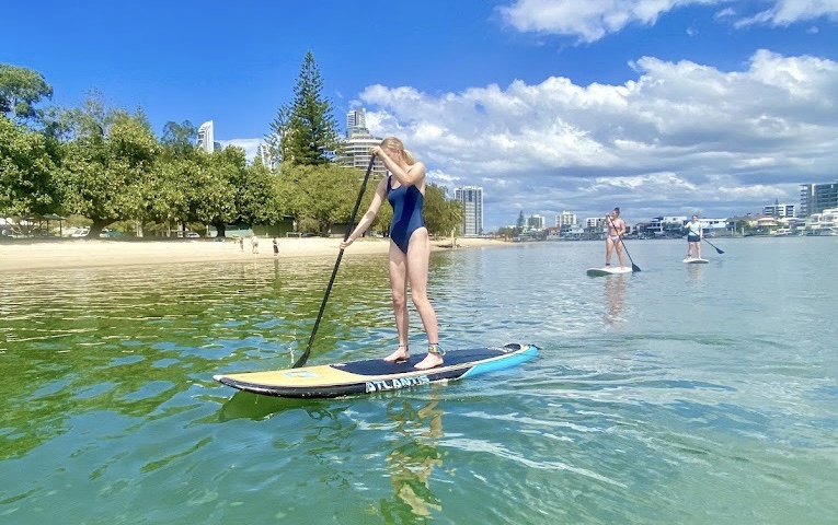 guy doing stand up paddle board lessons and tour Gold Coast Surfers Paradise